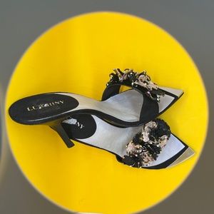 NWT. LUICHINY, SEXY TIMELESS HEELS,  METAL TOE PLATE, SZ.10, BLACK,